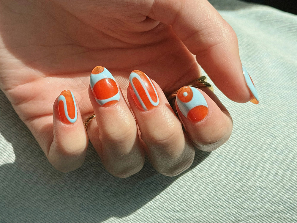 White and orange spa manicure nail design